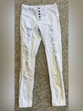 High-Rise White Distressed Skinny Jeans with Button-Fly